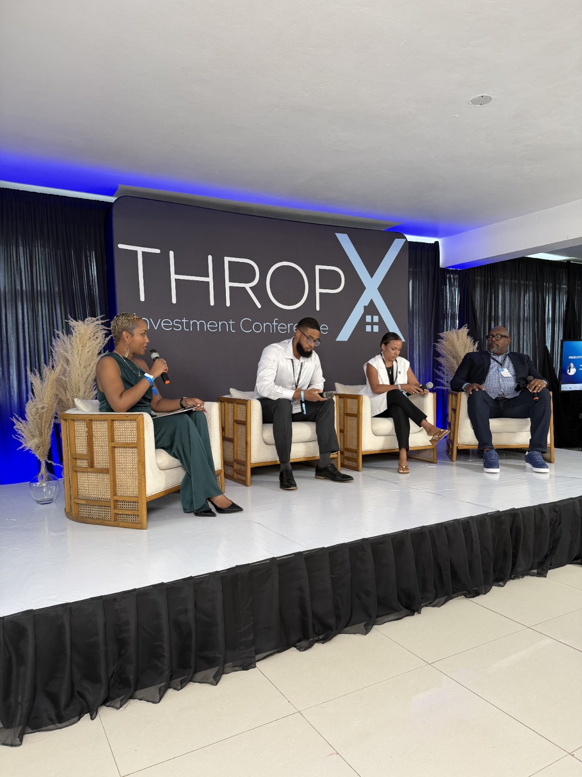 Kalilah Enriquez Reynolds moderating a panel at the THROP-X Investment Conference